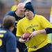 Former Michigan football player Dave Crispin runs the ball during the annual alumni flag football game before spring practice at Michigan Stadium on Saturday, April 13, 2013. Melanie Maxwell I AnnArbor.com